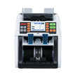 Banknote counting machine on a reflective surface with a gray background